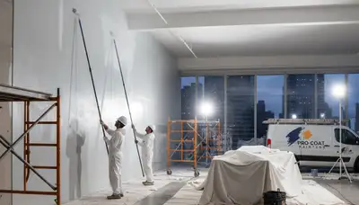 Commercial painters applying durable coatings at an Arlington, TX business site