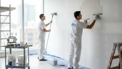 Arlington, TX painters repairing drywall cracks and holes in a home interior